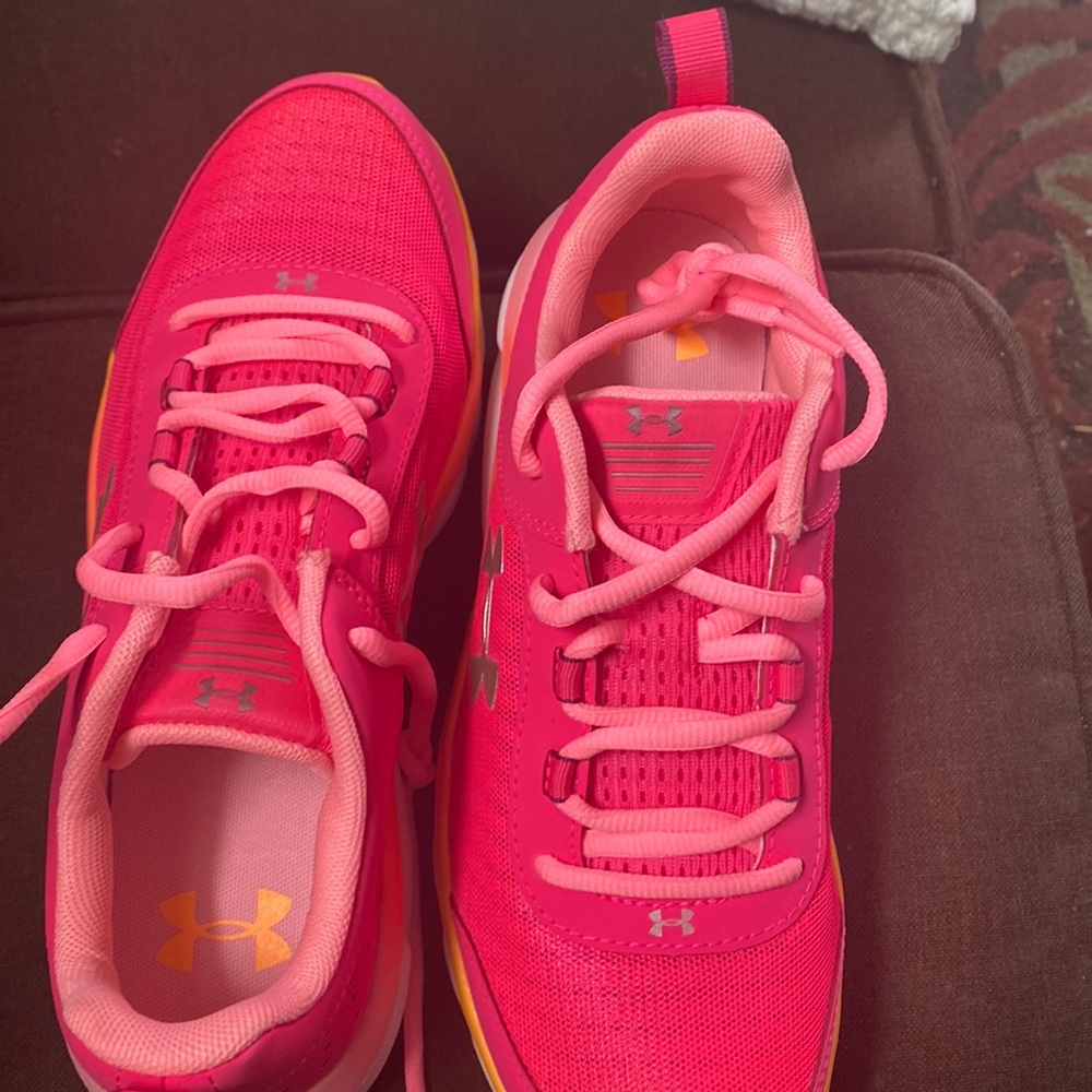 Under armor sneakers color pink orange  never worn  size 7y